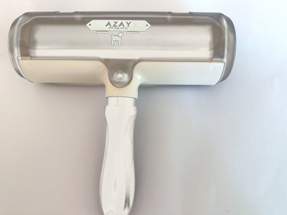 AZAY reusable pet hair remover in Cream White, with clear collection drum and ergonomic handle